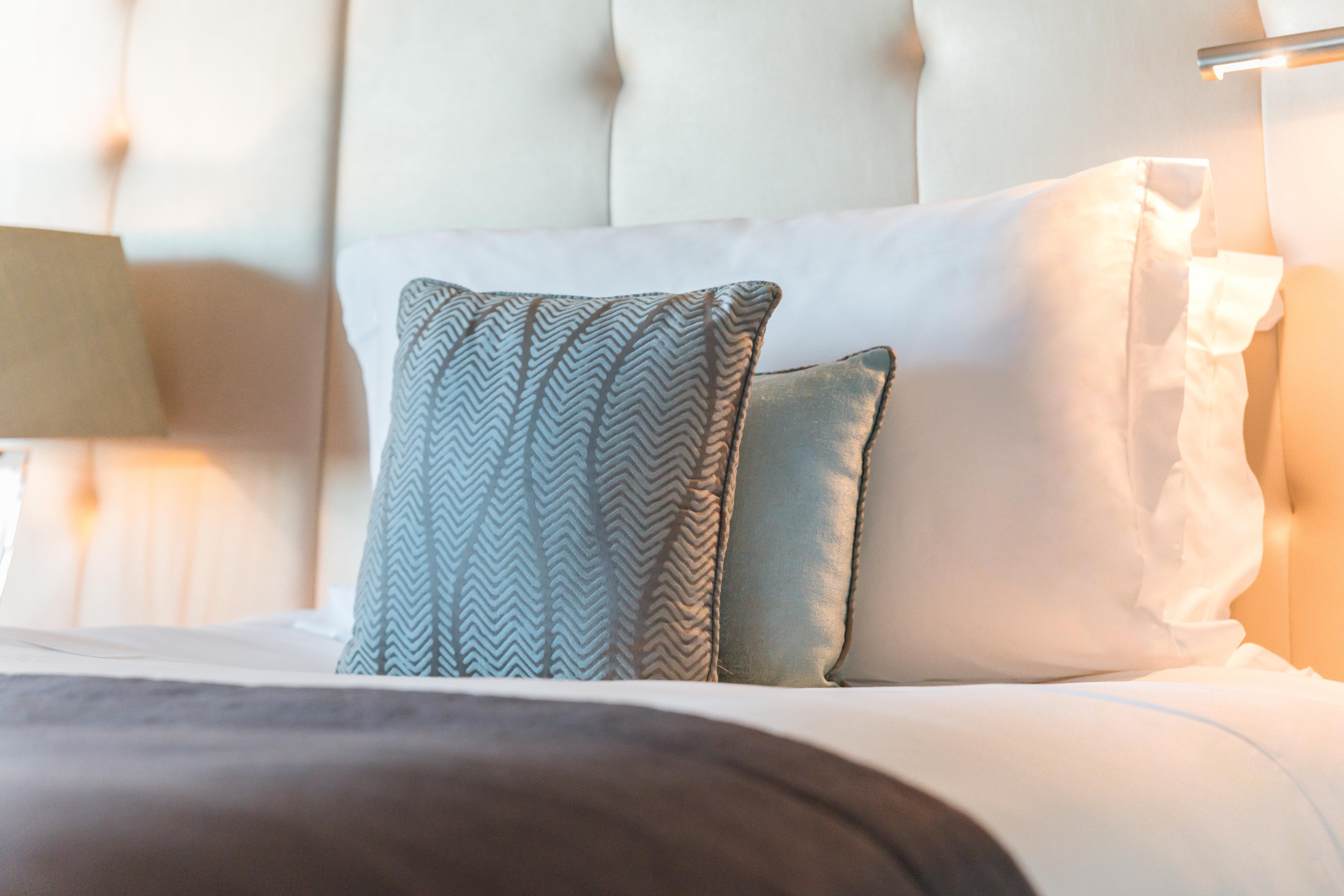 Intercontinental Lisbon By Ihg Hotel Exterior photo A throw pillow on a bed